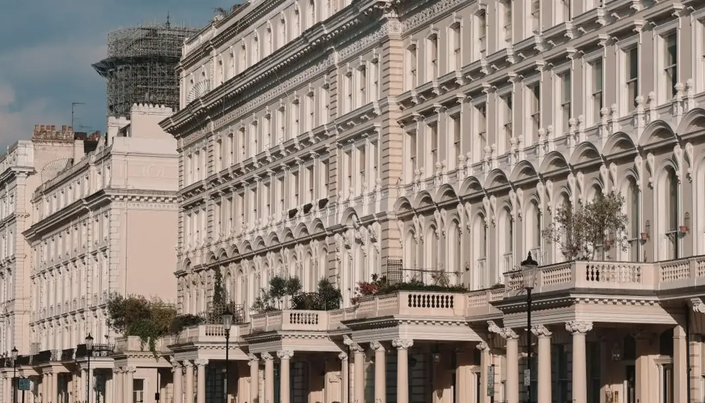 A long row of white stucco London townhouses